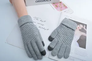 Grey knitted touchscreen gloves for winter, warm fleece-lined five-finger thermal gloves.