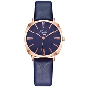 Detailed view of the women quartz watch with blue dial, rose gold square case and strap.