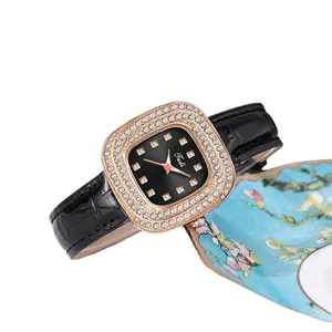 Elegant square rhinestone women watch with black leather strap and quartz dial for daily wear.