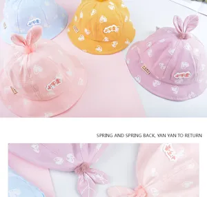 Cute baby bucket hat infant spring thin sun hat with adorable bunny ears and heart print.