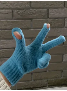 Detail view of blue knitted winter touchscreen gloves highlighting the flexible finger design.