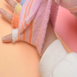 Kids colorful striped fuzzy fingerless gloves detail view showing soft knit texture and cute