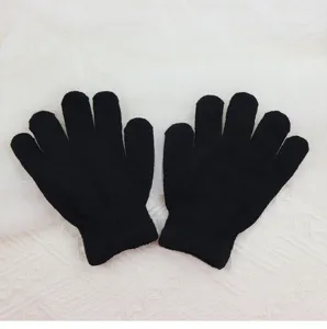 Kids black knit gloves detail shot, soft stretchy fabric, comfortable fit for children daily wear.