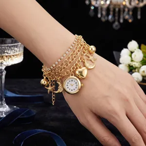 Gold multi-layer charm bracelet watch with quartz dial, star and heart pendants for women.