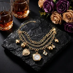 Gold multi-layer chain bracelet watch with heart and diamond charms, stylish quartz timepiece.