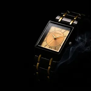 Men's quartz watch featuring a rectangular black and gold dial with Roman numerals.