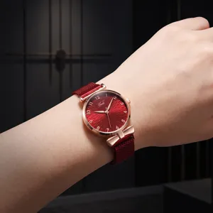 Chic women's quartz watch with red sunburst dial, rose gold case, and a stylish bow mesh strap.