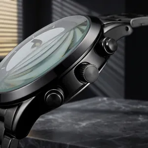Men quartz watch with curved glass crystal, stylish black metal case, minimalist dial design.