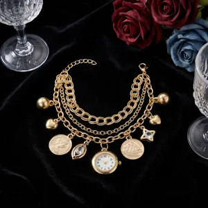 Elegant multi-layer gold chain quartz watch bracelet with vintage coin and heart charms.