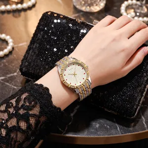 Women quartz watch with rhinestone bezel, starry dial and two-tone steel strap fashion.