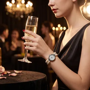 Detailed shot of the exquisite double-row pearl stretch quartz watch worn elegantly.
