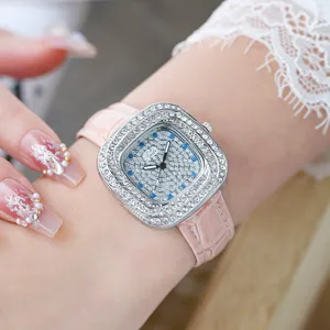 Detailed close-up of women's square quartz watch with diamond bezel and pink leather strap.