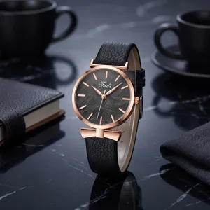Women quartz wristwatch with black leather strap leaf textured dial bow detail fashion