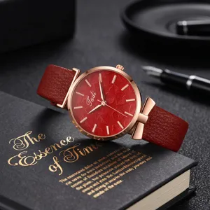 Elegant women's quartz watch featuring a red leaf embossed dial and pink gold case.