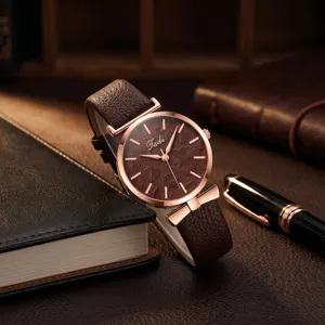 Women quartz watch with brown leather strap, rose gold case and leaf textured dial.