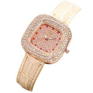 Women square rhinestone quartz watch with beige leather strap and starry dial design.