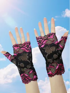 Detail shot of women's black and pink lace half finger sun protection gloves textile detail.