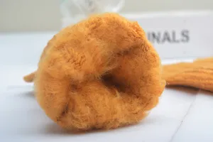 Close-up detail of women winter thickened plush fleece lined warm glove interior texture.