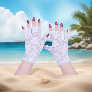 Detailed view of white lace fingerless gloves, elegant summer sun protection accessory.