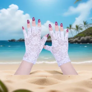 White lace half-finger sun protection gloves for women, elegant summer mesh design.