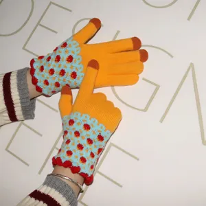 Knitted touchscreen gloves detail, colorful patterned cuff for cozy winter daily wear.