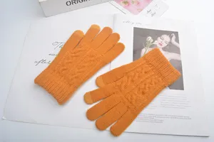 Detailed view of winter knitted touch screen gloves in bright yellow with warm cable knit design.