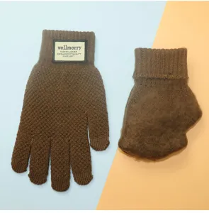 Detailed close-up view of winter touch screen knitted gloves with plush warm lining, brown.