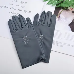 Women short sun protection gloves with delicate flower embroidery for summer driving and use.