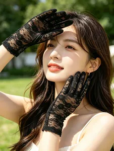 Black lace sun gloves detail shot, delicate floral mesh design for summer elegance.