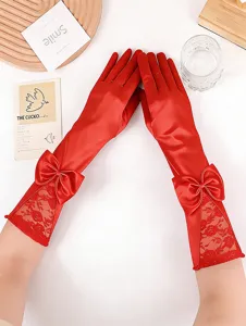 Red satin long gloves with elegant bow and lace details for evening wear and weddings.