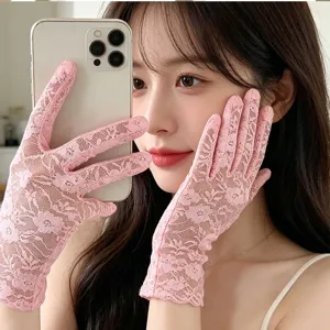 Elegant pink lace sunscreen gloves, delicate mesh floral design, summer accessory.