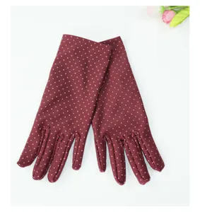 Women summer thin spandex polka dot gloves detail, elegant stretch driving sun protection.