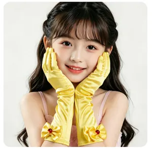 Gants de performance en satin jaune pour enfants avec nœud et pierre rouge style princesse.