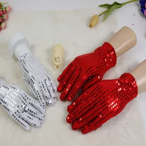 Children performance sequin gloves, dazzling dancing gloves in red and silver for party.