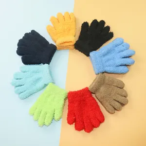 Colorful fuzzy knit kids gloves detailed view, soft winter thermal gloves laid in circle