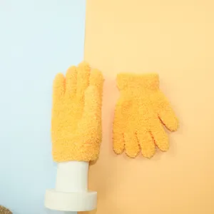Detailed view of yellow fleece-lined children winter knit gloves close-up display