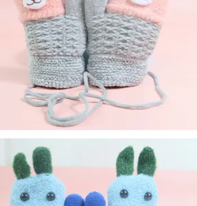 Kids cute winter knit gloves detail shot showing soft plush bear and rabbit animal design.