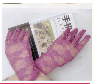Detail view of elegant purple lace gloves featuring delicate floral mesh and breathable fabric.