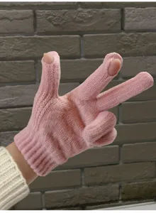 Close-up detail of pink knitted two-finger exposed touchscreen winter warm gloves display.