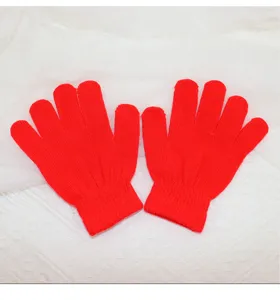 Children red knit gloves detail view, soft warm winter knitwear accessory for kids everyday wear