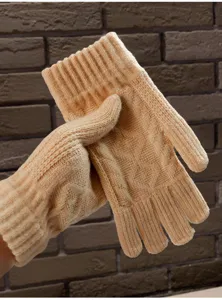 Close-up detail of winter warm knitted touch screen gloves, soft cable knit design for cold days.