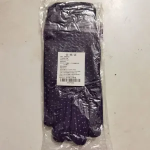 Women's dotted knit gloves with packaging tag, comfortable fabric for daily wear and cycling.
