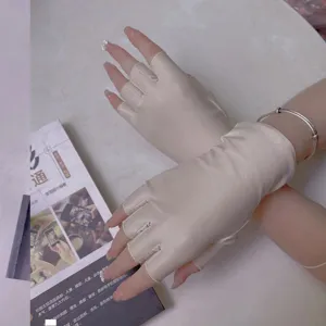 Detailed view of women's half finger sun protection gloves, elastic fabric for driving outdoor.