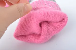 Close-up view of the thick plush fleece lining inside the winter warm knitted gloves.