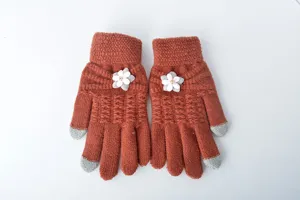 Winter warm knit touchscreen gloves detail view with cute flower decor and grey fingertips.