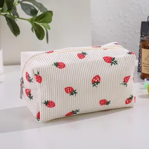Corduroy strawberry print cosmetic bag, large capacity portable makeup storage pouch.
