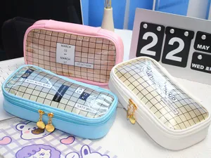 Transparent grid pencil case detail view showing cute multi-color stationery bags on desk.