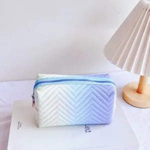 Gradient cosmetic bag with zipper closure, stylish travel toiletry pouch and makeup organizer.
