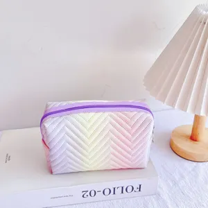 Gradient cosmetic bag with chevron pattern, portable travel makeup pouch for daily use.