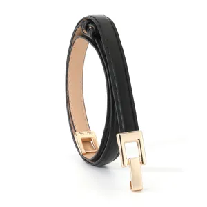 Close-up detail of a slim black leather belt featuring a sleek gold rectangular buckle 1.4cm